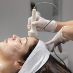 young woman having facial treatment